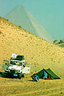 Jeep (Toyota Land Cruiser) & man at campsite in front of Kheops pyramid