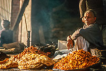 Fritter vendor at market
