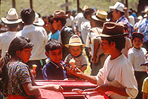 Children bying ice cream from merchant at cockfighting & recreation field