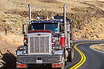 Truck on winding road in dryland