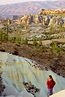 Petra in front of white tuff gullies at sunset