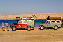 Petra taking picture of Ammar near 2 landy