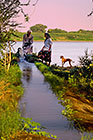 pumping water into irrigation canal + Petra & fellah discussing