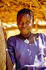girl dressed in blue robe with cross