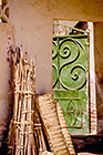 green iron door + straw nattes