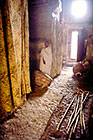 inside church with sticks, arcades & door