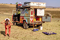 Petra cutting her hair + landy (RL) at campsite