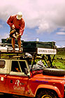 Paul attaching chicken on landy (L) roof