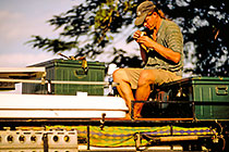 Paul repairing CapSat antenna on landy roof