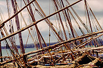 dhows in harbor + stormy clouds