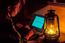 Petra working on mac with petrol lamp