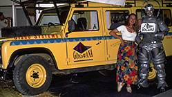 Petra & Oracle Digital robot in front of landy w solar pannels on stand