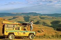 Petra filming on top of landy(R) on rd + mts + clouds
