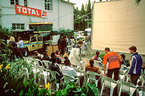people sitting + landy(F) + big screen