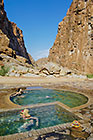 people bathing in hot springs
