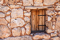 wooden shutter & stone wall of house of old settlement