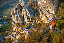 Enya & James walking on mountain at sunset