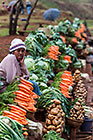 people selling vegetables along road