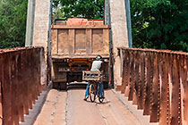 bicycle & truck on narrow bridge