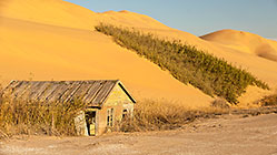 fisherman cottage sinking in sand