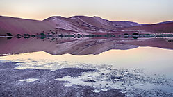 sand dunes reflection at sunrise