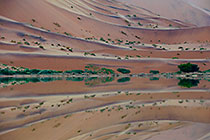 sand dunes reflection at sunrise