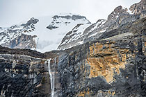 waterfall on mountain cliff
