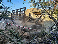 bulldozer making access road to plot