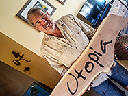 Paul carving Utopia name on wood for sliding gate
