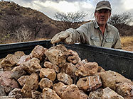 Paul loading stones for gabion in ranger