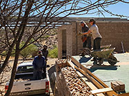 Donald & Sedney throwing stones to Paul & Lisa on gabion room suspended slab