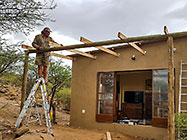 Paul building roof over studio deck