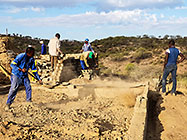 Donald & Sedney levelling house office slab & Bernard workers building founation walls