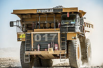 90 T truck driving on top of waste pile