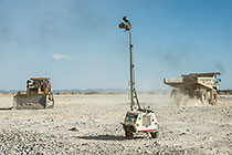 lighting trailer, 90 T truck & bulldozer on top of waste pile