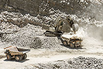 excavator loading 90 T trucks in pit