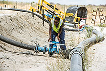 worker closing valve of waste water from processing plant