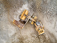 aerial vbiew | front l;oader loading 90 T truck in pit