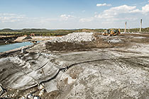 arsenic waste site | digger loader & roller compactor | water bassin
