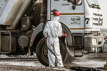 arsenic waste site | worker water cleaning truck
