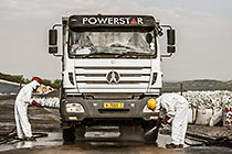 arsenic waste site | workers water cleaning truck
