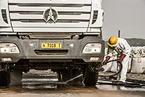 arsenic waste site | worker water cleaning truck