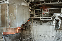 smelting of copper ore into bucket