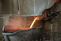 smelting of copper ore into bucket