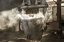 smelting of copper ore into bucket