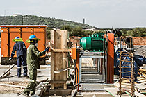 workers installing pumps for new water bassin