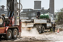 drilling truck for borehole near processing plant