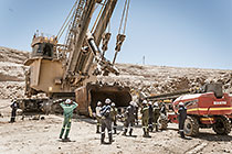 team changing bucket of rope shovel