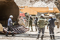 team changing bucket of rope shovel