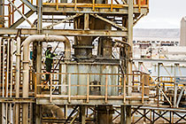 worker cleaning Counter Current Decantation (CCD) tower